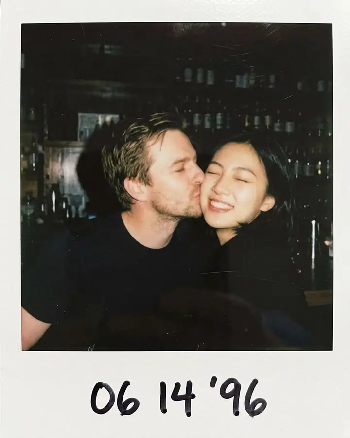 AI example of an instant-film photo of a couple cheek to cheek under a flash