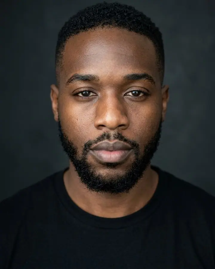 AI example of a natural actor casting headshot of a man against charcoal
