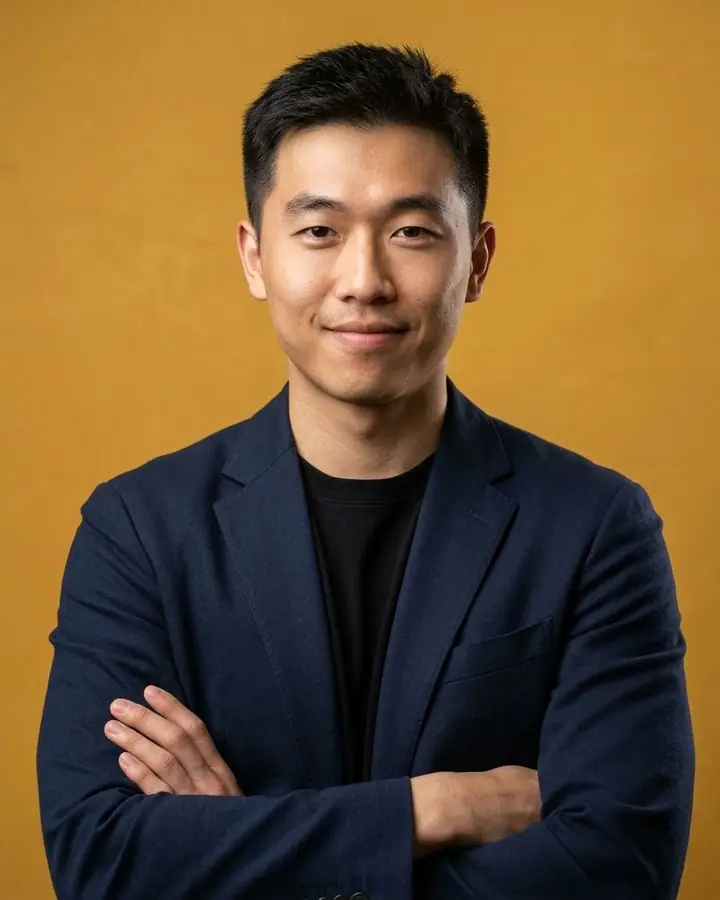 AI example of a startup founder headshot of a man against a mustard backdrop
