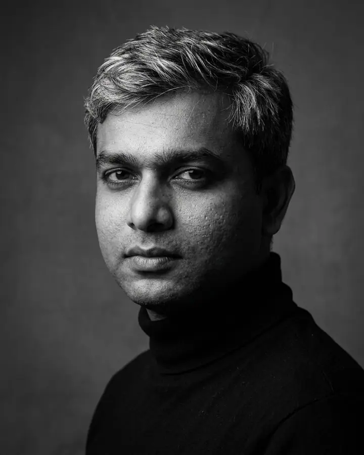 AI example of a dramatic black-and-white studio portrait of a man in a turtleneck