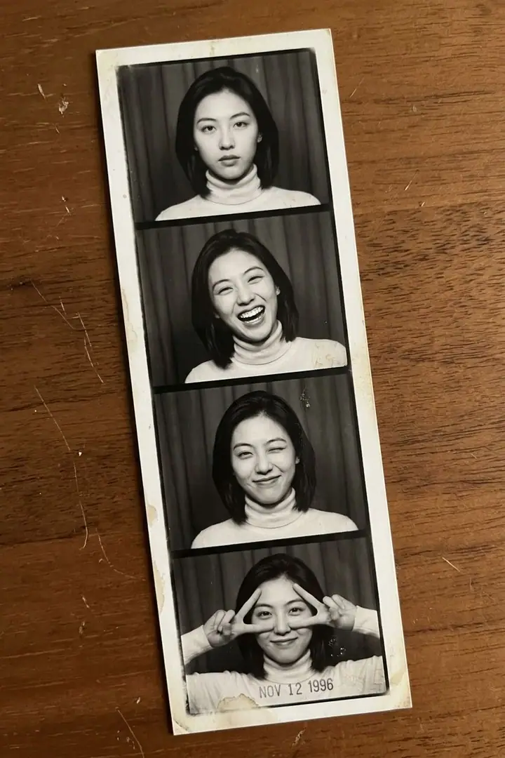 AI example of a four-frame black-and-white photo booth strip of a woman pulling poses