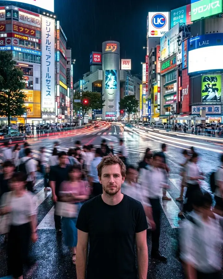 AI example of a man standing still in a neon-lit crossing as the crowd blurs past